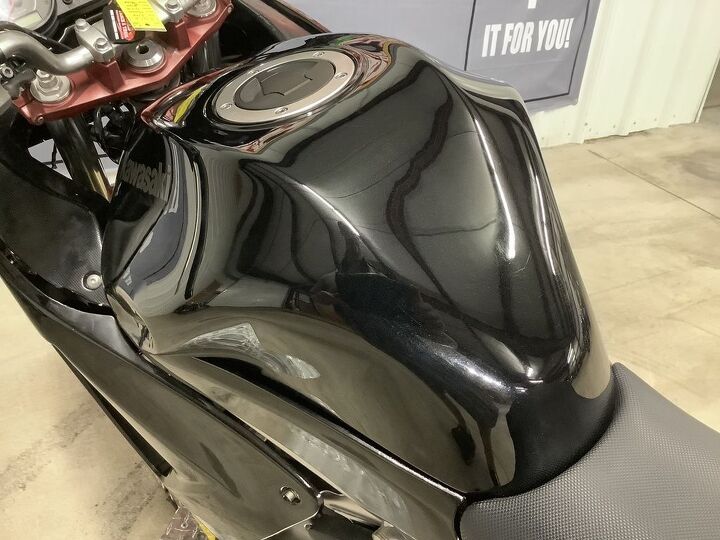 stock fuel injected sport bike has left side tank dent and scratches we