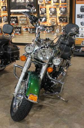 rare color in the saddle of a harley davidson softail no road is ever lonely