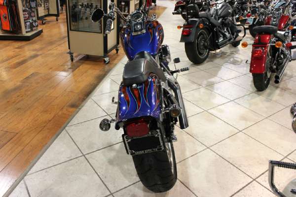 custom paint in the saddle of a harley davidson softail no road is ever