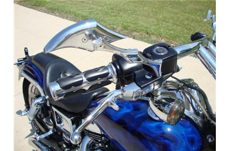 this dyna low rider custom has been heavily modified with a truckload of chrome