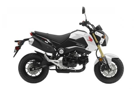 this grom is set up and looks amazing we added some dirt 60 40 tires bar end