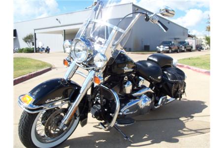 the smooth riding enjoyment of custom touring aboard the heritage softail classic