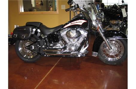 softail heritage with quick release saddlebags and vance and hines short shots