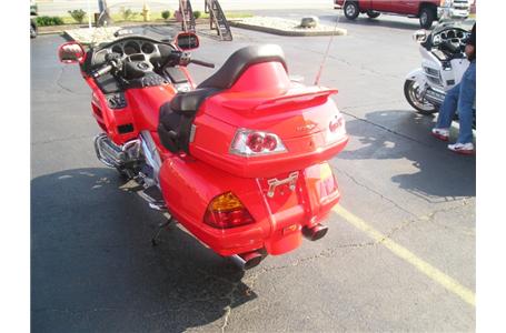 here is a very rare color option gl1800 goldwing in fire engine red very clean