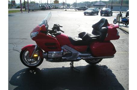 here is a very rare color option gl1800 goldwing in fire engine red very clean