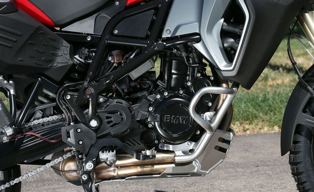 2014 bmw f800gs adventure review, Note the large footpegs and flip up brake pedal section in silver Engine guards are standard Vibey parallel Twin engine is untouched from the regular F800GS