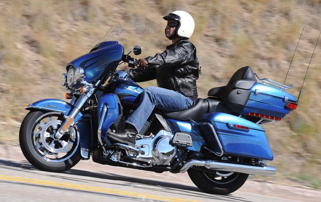 2014 harley davidson touring motorcycles review, At nearly 900 pounds wet it s a beauty of a beast but the Ultra Limited can hold its own in the premium touring motorcycle market