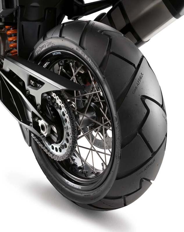 2014 ktm 1190 adventure review, The Adventure comes equipped with ContiTrailAttack 2 tubeless tires KTM s patented wire spoke rims are conventional in configuration without a cross spoke pattern or additional material A Tire Pressure Monitoring System comes standard