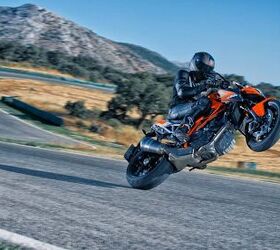 church of mo 2014 ktm super duke r review, We missed the wheelie photography session so here s a gratuitous wheelie shot from KTM s stock photo collection
