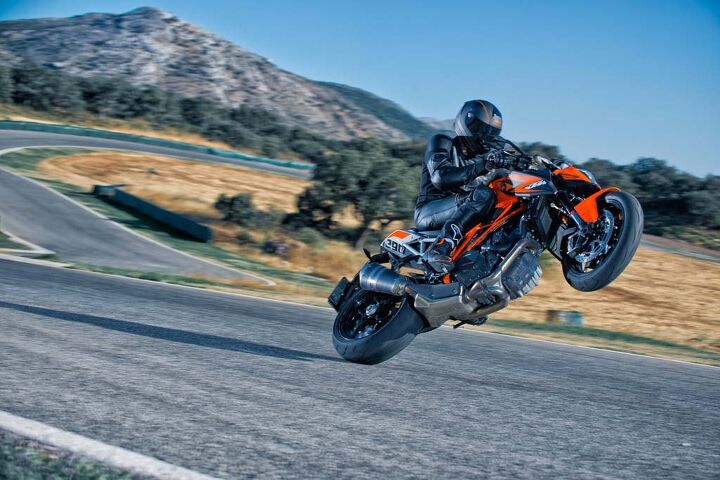 church of mo 2014 ktm super duke r review, We missed the wheelie photography session so here s a gratuitous wheelie shot from KTM s stock photo collection