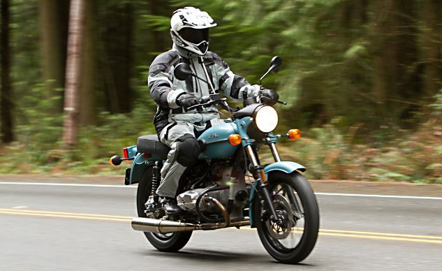 2014 ural solo st review, The Solo sT pictured here is a hybrid 2014 2015 model The tires and seat are not standard 14 fare Unseen are prototype triple clamps that decrease rake for quicker steering compared to the sidecar models Note the new spin on oil filter front and center on the redesigned engine cover