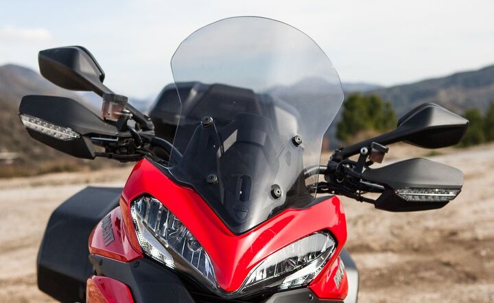 2014 ducati multistrada granturismo review, The taller windscreen on the Granturismo is manually adjustable on the fly to rider preference