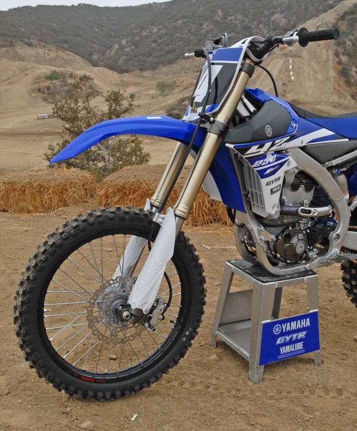 2015 yamaha yz250f first ride review, Yamaha continues to resist the air sprung fork trend in motocross and stick with a proven coil spring design The YZ250F s KYB fork features Speed Sensitive damping cartridges with revised settings for 2015 Suspension travel is 12 2 inches up front The fully adjustable KYB piggyback reservoir shock out back provides 12 4 inches of travel