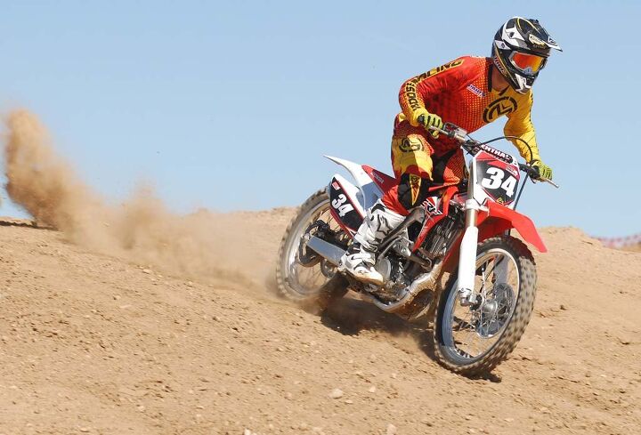 2015 honda crf250r first ride review, Once we had the fork set to our liking we appreciated its compliance over small bumps and big hits alike Honda s Pro Link rear shock and linkage are unflappable delivering a plush ride all around the track