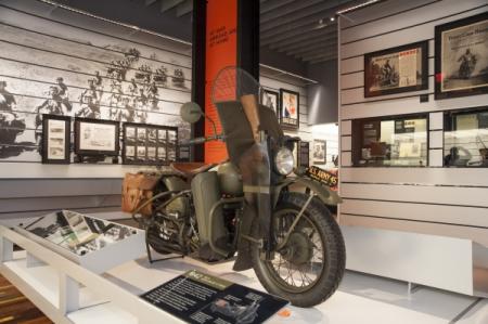 visiting the harley davidson museum, Harley Davidson played a major part in the war supplying the military with more than 60 000 WLA models In response to the steel shortage of the time oil was shipped in glass containers