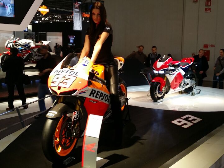 duke s den inside eicma the world s biggest motorcycle show, We re dying to find out more about the stunning red white and blue RC213V S MotoGP based streetbike but Honda is keeping its lips tight The prototype at EIMCA was so guarded that models were allowed to sit on one of Marc Marquez s GP bike but not the the precious RC213V S Photo by Sean Alexander