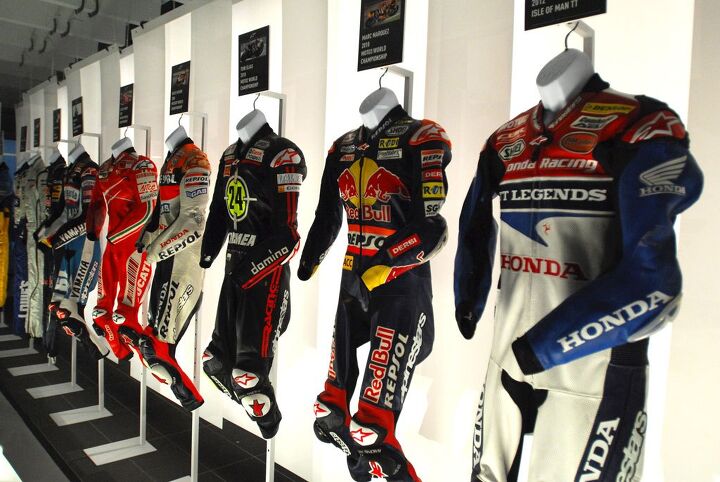 alpinestars 50th anniversary celebration, This Champions Wall of Fame display included suits worn by Alpinestars athletes such as 2012 Isle of Man TT Champion John McGuiness Moto2 champions Marc Marquez and Toni Elias MotoGP Champion Nicky Hayden World Superbike Champion Ben Spies and even Formula One World Champion Sebastien Vettel That s a lot of glory in one display