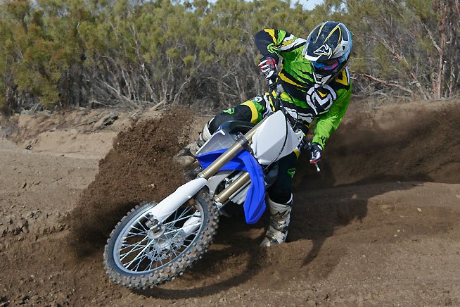 2015 yamaha yz250fx review, Railing berms on the FX is no different than doing the same on the YZ250F The FX exhibits extremely light and precise steering that rivals the YZ s even though the FX weighs 18 lbs more than the motocrosser