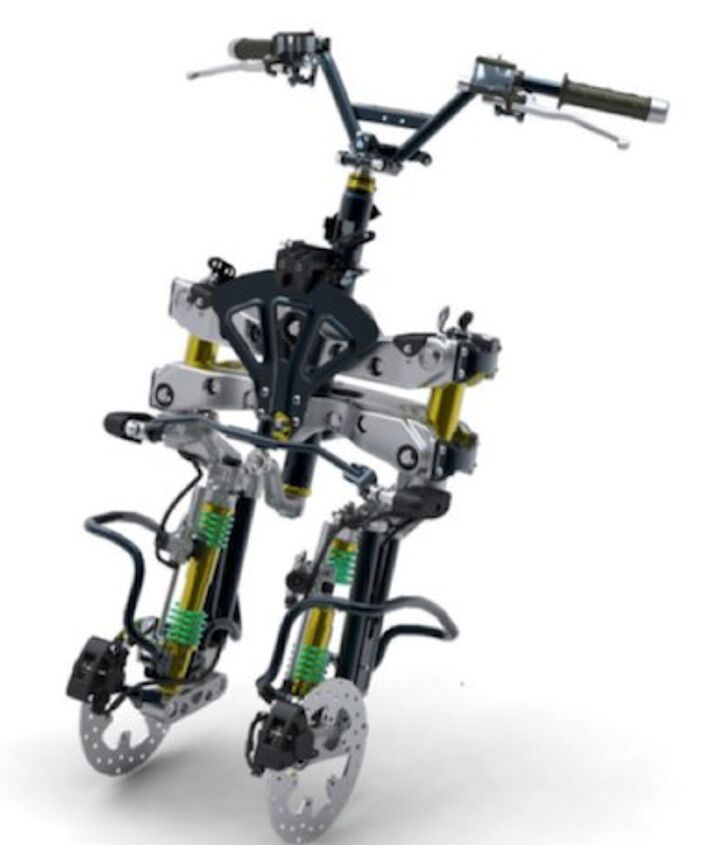 three wheeler threeway, The MP3 s front end is comprised of two leading link fork legs that instead of sharing a common wheel between them are each outfitted with its own wheel The two wheels steer in concert but suspension duties are independent of one another The black fan looking thing near the steering head is the tilt lock mechanism that keeps the MP3 from falling over when stopped basically a partial brake disc gripped by a caliper