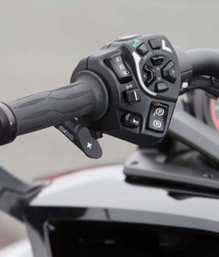 three wheeler threeway, It may not lean but the Can Am Spyder oozes electronic tech in the form of ABS TC cruise control optional semi automatic transmission and optional heated grips The Spyder also offers voluminous storage capacity and very comfortable passenger accommodations Base model F3 Ts start at 23k the Limited Special Series we tested runs a tad over 27k