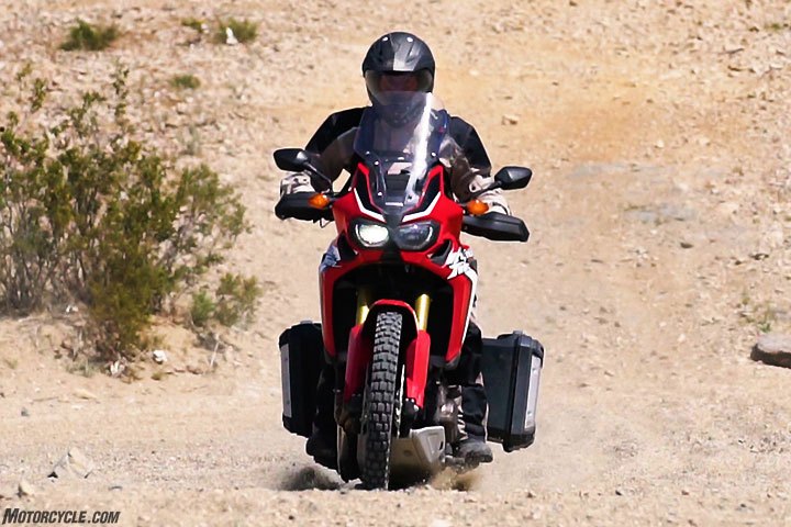 2017 honda crf1000l africa twin vs ktm 1090 adventure r, We d rate the Honda s suspension as 70 30 that is to say that it is 70 oriented toward street use and 30 toward off road use Both ends are fully adjustable but the Africa Twin feels underdamped and it can bottom and top out when the going gets rough