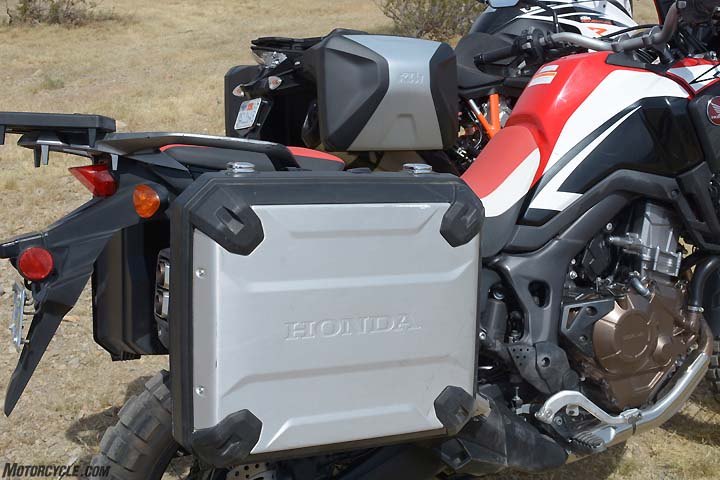 2017 honda crf1000l africa twin vs ktm 1090 adventure r, There is a stark contrast between the quality of accessory saddlebags on this pair of ADV machines The KTM s bags dominate the Honda s when it comes to fit finish mount security open close and locking in other words the KTM bags win in just about every conceivable way they could