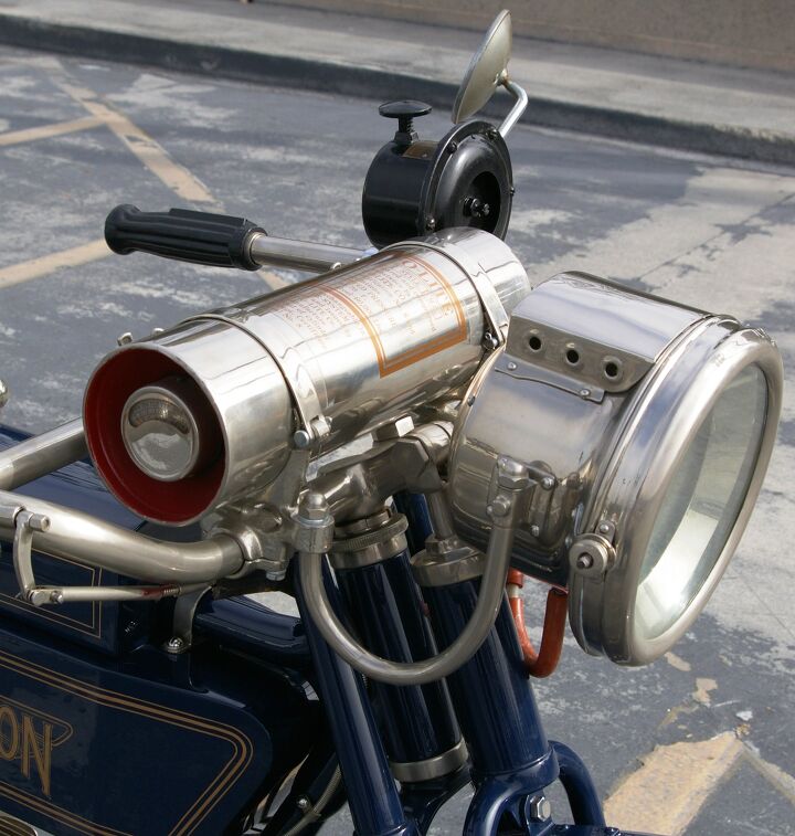 the history of four cylinder motorcycle engines in america, Works of techno art in their own right the Henderson s acetylene powered headlamp and canister that contains its fuel a mixture of calcium carbide and water First discovered in 1892 acetylene soon powered lighting for lighthouses miner s caps bicycles and cars Seen here also mounted on the handlebar is a large horn sometimes mistaken for a siren Just press down on the plunger to get tooting