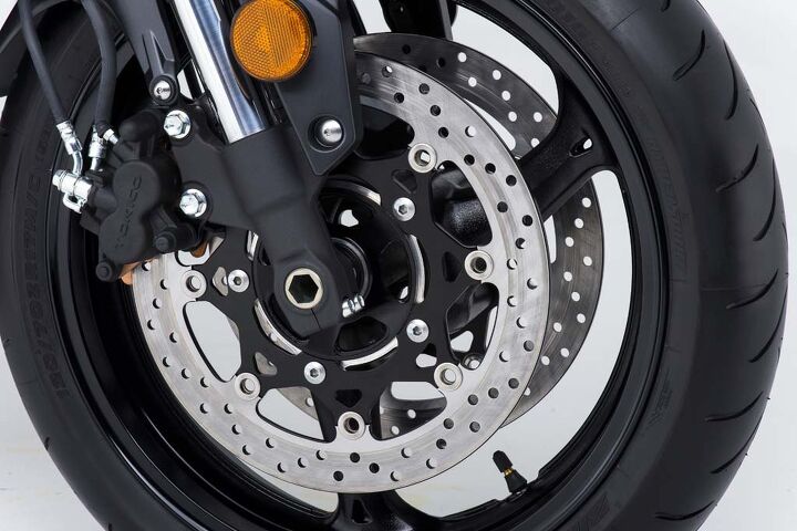 2015 suzuki gsx s750 review, Twin 310mm discs are gripped by dual piston Tokico calipers up front with a single 240mm disc and single piston caliper at the rear Stopping power and modulation seems more than adequate for street sport application