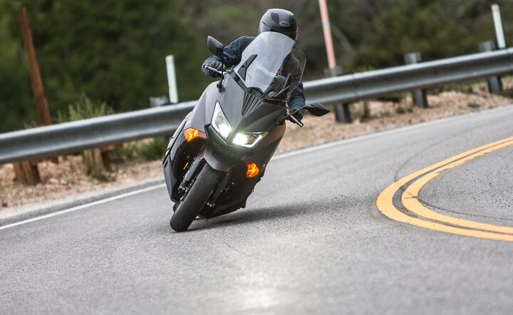 2015 yamaha tmax review, How confidence inspiring is the TMAX when cranked over See the headlight sheen on the pavement That s rain
