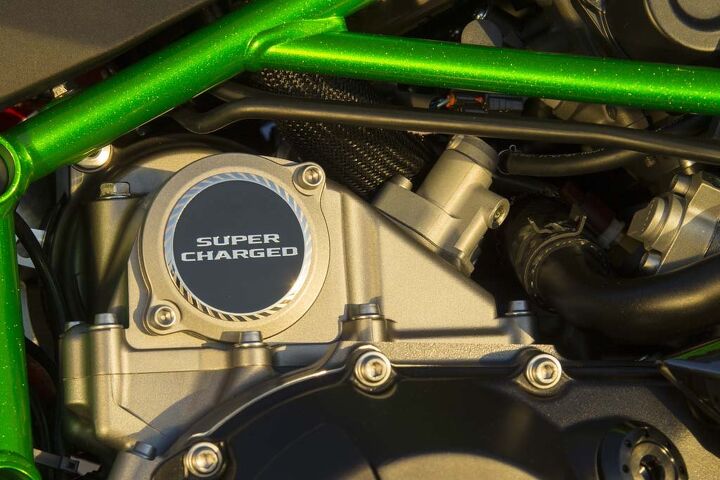 2015 kawasaki ninja h2 first ride review video, The supercharger is nestled between the rider s knees The assembled unit and its cast aluminum housing weigh less than 10 pounds