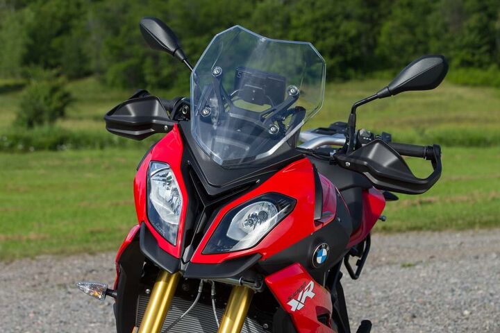 2015 bmw s1000xr first ride review, Asymmetric eyeballs are a BMW styling thing now The XR inhales through its steering head just like the S1000RR Somebody needs to build a screen to protect its big radiator and oil cooler below it from front tire roost