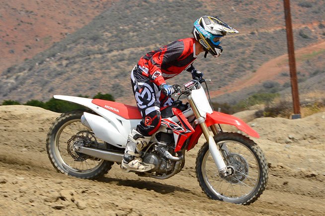 2016 honda crf450r first ride review, The CRF s KYB 48mm Pneumatic Spring Fork now boasts 5mm longer legs to raise the front end of the bike aiding in stability both when cornering and while straightlining over fast choppy ground