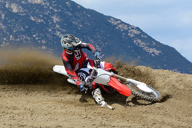 2016 honda crf450r first ride review, Previous CRF450R models tended to oversteer in corners causing the front end to knife or grab traction earlier than the rider wanted The new fork and revised linkage make the steering more neutral helping to increase rider confidence