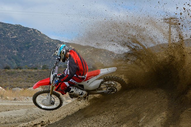 2016 honda crf450r first ride review, With its revised linkage ratio the CRF450R makes better use of its electric like 450cc power curve which makes it easier than ever to rocket out of a corner