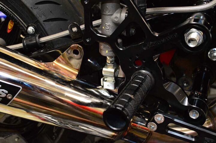 building a honda grom roadracer, however the Alien Head exhaust system was designed to clear the standard footpegs With our Woodcraft rearsets in place the megaphone makes contact with the rear master cylinder plunger We didn t take this into account when ordering parts
