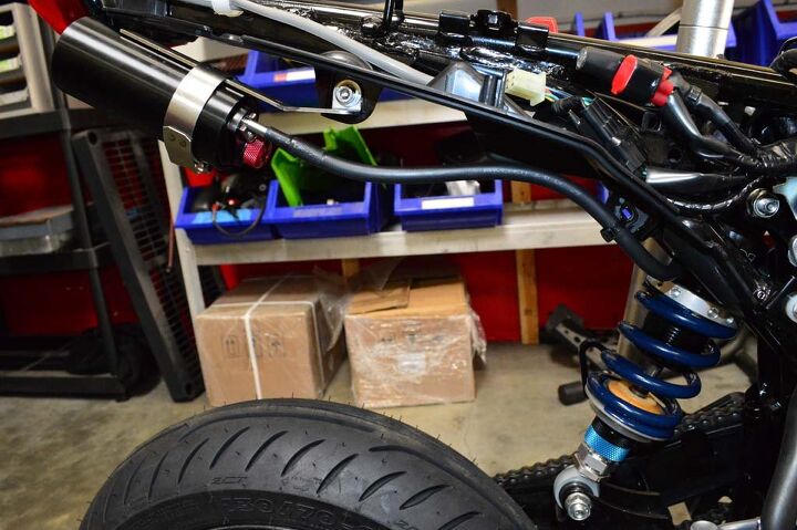 building a honda grom roadracer, Installation of the shock is a straightforward affair and since we re running a low slung exhaust the stock exhaust bracket made a perfect mounting point for the JRi s remote reservoir