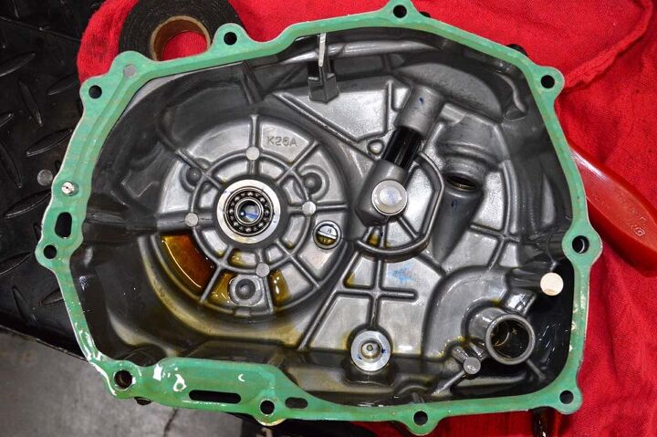 building a honda grom roadracer, If you re careful and or lucky the stock gasket will remain intact once the cover is removed It s a good idea to have a replacement gasket in case the stock one doesn t cooperate upon removal