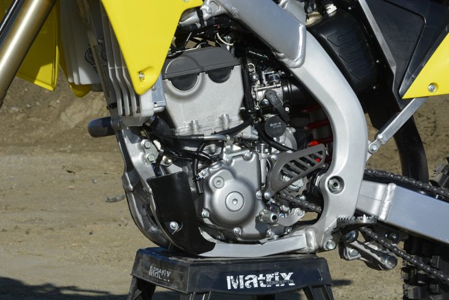2016 suzuki rm z250 review, Suzuki engineers labored to give the RM Z250 s liquid cooled fuel injected DOHC engine a little more pep for 2016 It shares the same bore and stroke as the previous version but a new piston crank intake valves and cams are among the host of updates it has received