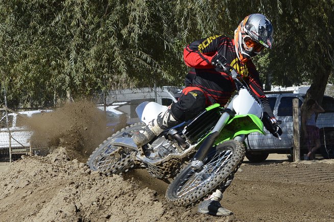 2016 kawasaki kx250f review, The tradeoff for the KX s high speed stability is a machine that must be coaxed to hold a tight line in flat or rutted corners The KX s front end delivers a vague feel unless you steer it with the throttle