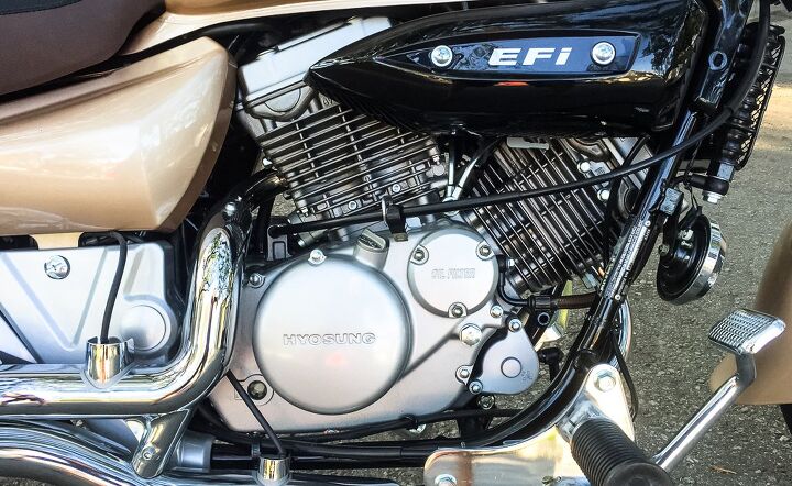 2015 hyosung gv250 aquila review, The GV250 s engine is pretty nice looking piece The EFI performs predictably in all the throttle situations I encountered On the exhaust headers the oxygen sensor wires rear their ugly heads