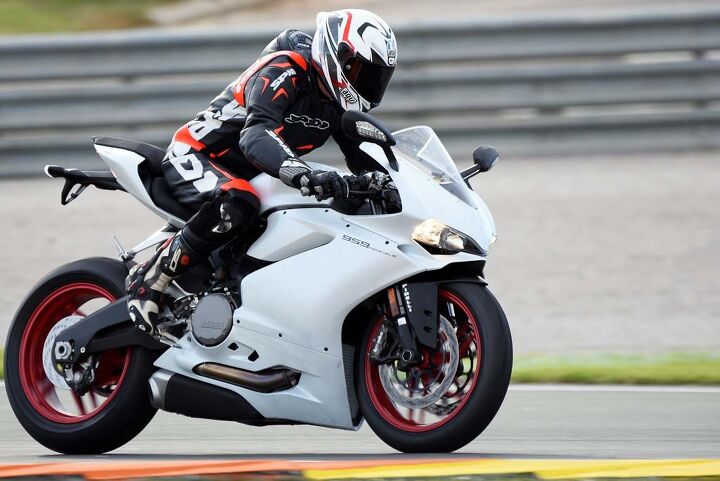 2016 ducati 959 panigale first ride review video, Showa s Big Piston Fork being put to the test at Valencia The BPF design is lighter than a traditional inverted fork and does a fine job of controlling damping during low speed events such as when braking
