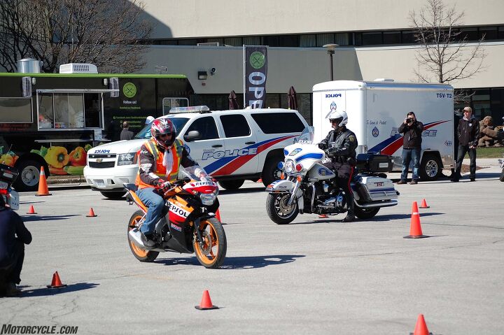 motorcycle safety awareness, On a makeshift intersection marked by pylons a combination of riding school Honda CBR125Rs and Harley Davidson police bikes demonstrated slow speed control and proper riding technique