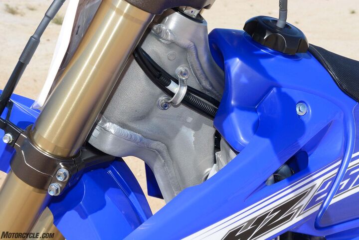 2016 yamaha yz250x review, As you can see here the YZ250X also uses Yamaha s backbone style aluminum frame The motocross derived chassis works well in almost all off road situations but gets just a tad squirmy at top speed