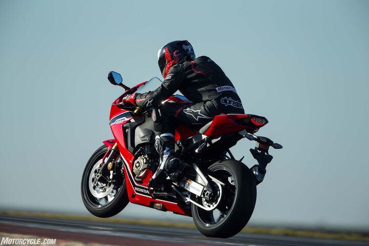 2017 honda cbr1000rr and cbr1000rr sp review, The Portim o track is a wheelie lover s dream as its extreme undulations are perfect for hoisting the front in the air That is unless you ve got the Honda s wheelie control Sometimes the front will crawl upwards controllably other times it would shoot up faster than you d expect before abruptly cutting power Other times it won t come up at all