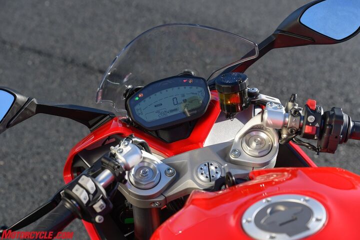 2017 ducati supersport review, Notice the clip on bars mounted above the top triple clamp This is a key component to the Supersport s all around rideability The rider is crouched forward far less taking pressure away from the wrists and lower back