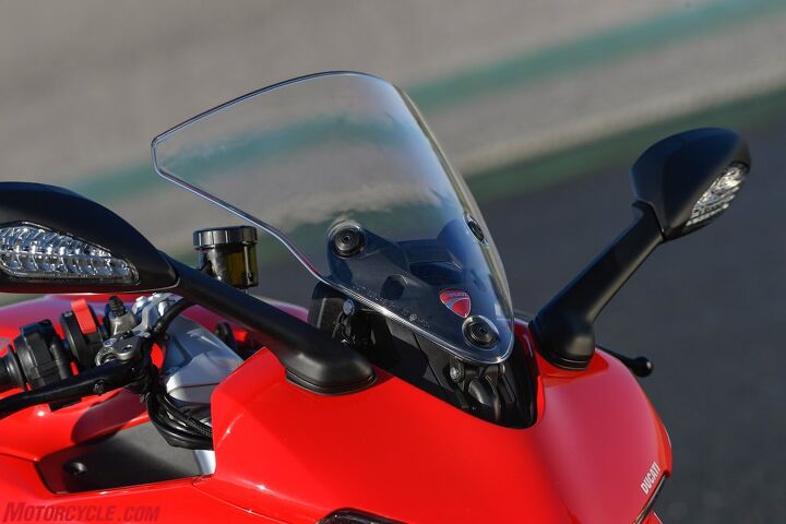 2017 ducati supersport review, For a little extra wind deflection the windscreen can extend another two inches by simply pulling it to this raised position If that s still not enough a larger screen is also available