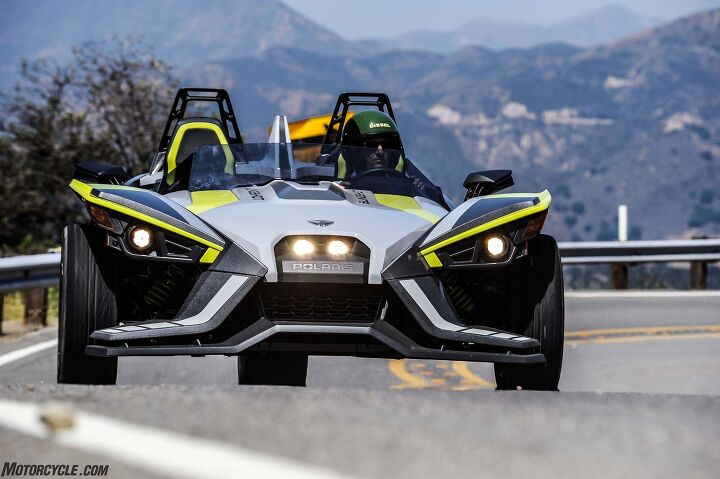 2018 polaris slingshot slr review, Ghost Gray and Lime Squeeze paint and graphics remind us of Yamaha s FZ 10 and reveal this Slingshot as the top line LE version which adds adjustable Bilstein shocks and an extra 100 watts of power to the regular SLR s 100 watt Rockford Fosgate audio system