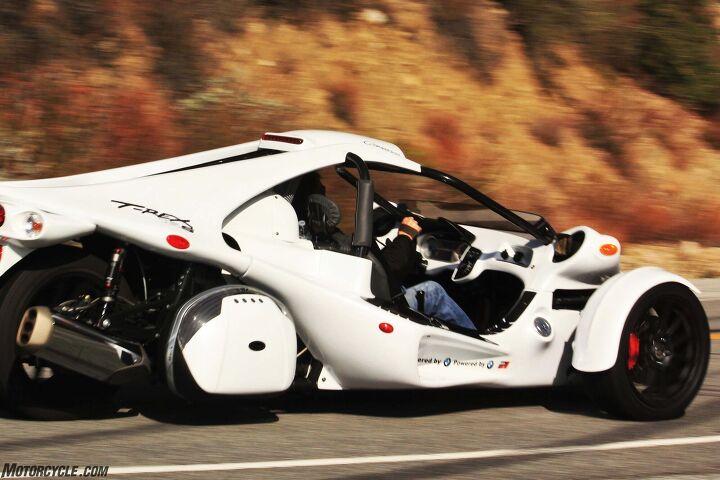 campagna t rex 16sp review, The back end of the T Rex holds BMW s lusty and sonorific Six sending 160 horsepower to a 275 40 18 rear tire via BMW s six speed sequential gearbox and a chain drive Torque is rated at 129 lb ft at 5250 rpm Dual mufflers are direct from the K1600 to keep it EPA legal Optional Givi side cases add welcome stowage space to an interior that has almost none