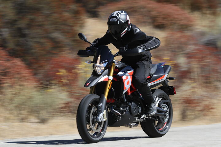 2018 aprilia dorsoduro 900 first ride review, It s best to just lean into the wind and let it hold you up while highway cruising on the Dorsoduro