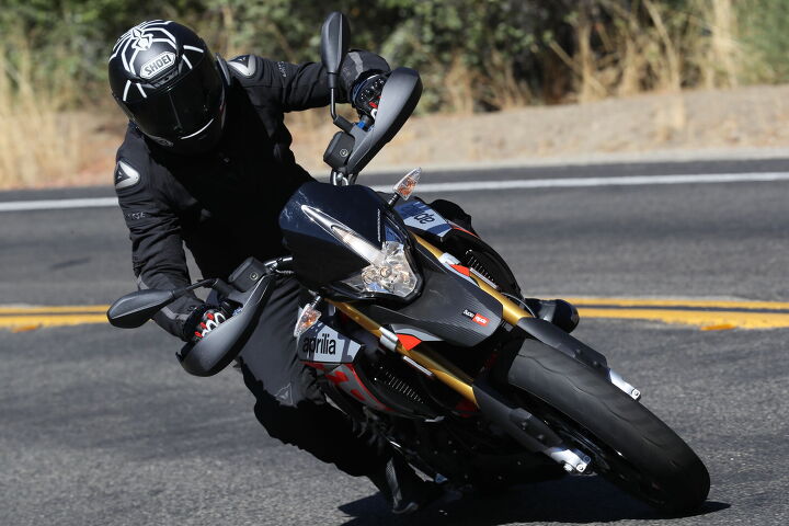 2018 aprilia dorsoduro 900 first ride review, The wide handlebar gives all the leverage you could ask for Standard hand guards provide wind protection and additional butch factor